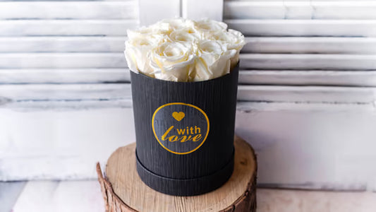 7 long lasting White Roses in a Black Box