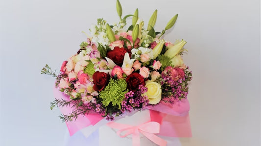 Bouquet Of Various Seasonal Flowers In A White Box