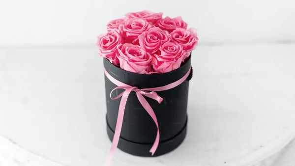 9 Pink long lasting Roses in a black box