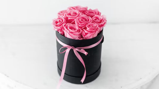 9 Pink long lasting Roses in a black box